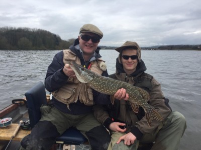 Charlie Noble & Harvey with his first pike on the fly